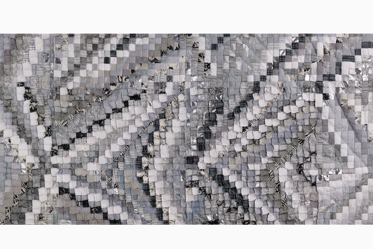 Sabine Cibert Sémagramme 219 ©Pascal Muradian Abstract grayscale patchwork quilt made of small square fabrics in varying textures and patterns? length varies intentionally for context.